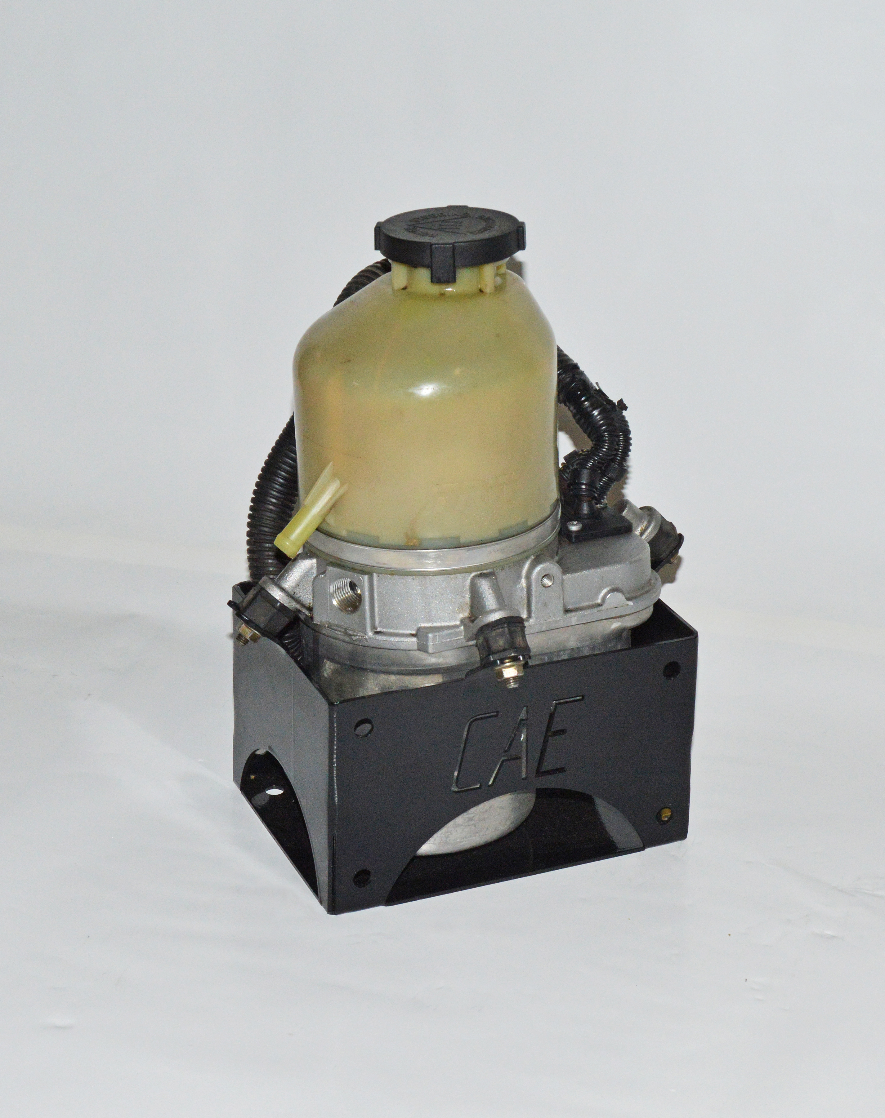 Electric power steering pump - second hand re-conditioned. Can be used with PWR_MOUNT to mount pump anywhere in vehicle as shown in pic
