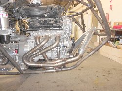 Headers are siamese tuned length 1 3/4in primaries into a merge collector with 2 1/2in outlet.