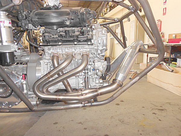 Headers are siamese tuned length 1 3/4in primaries into a merge collector with 2 1/2in outlet.